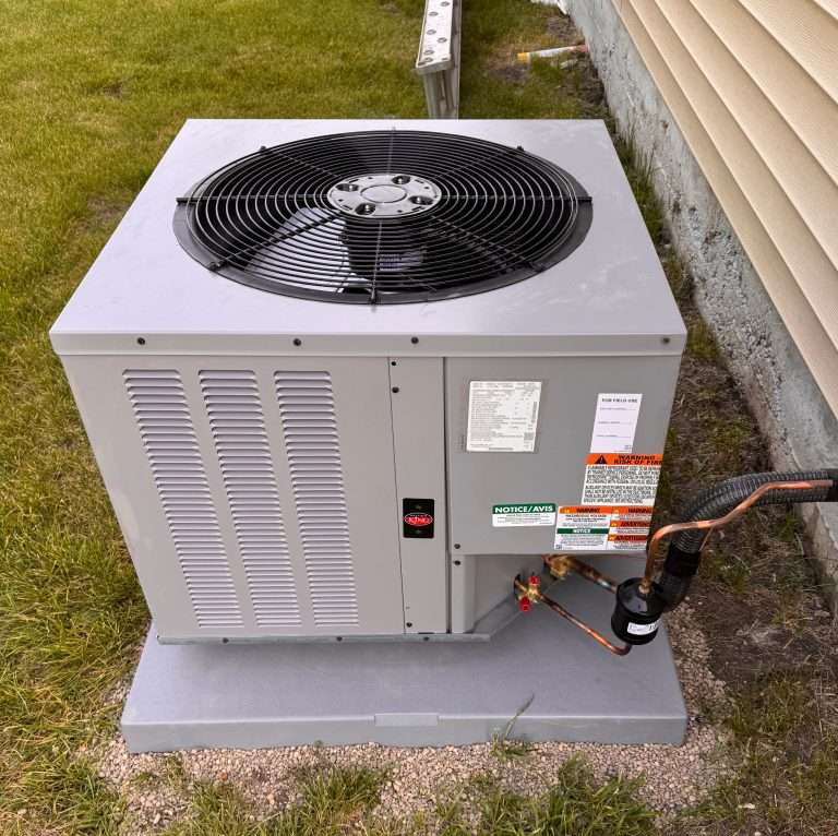 Ruud air conditioning unit installed outside Iowa home — TruLine HVAC AC repair